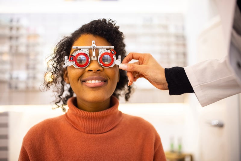 Woman smiling with examination glasses on her eyes