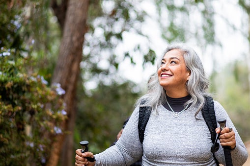 Woman hiking and admiring the outdoors