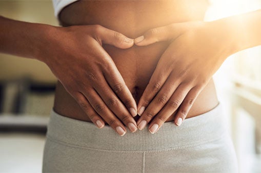 Woman touching her stomach
